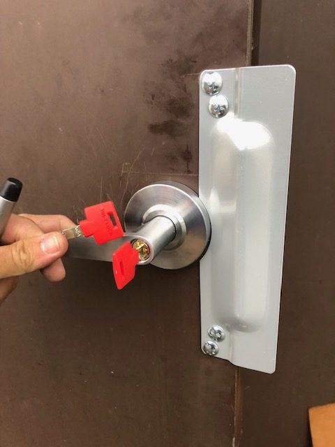 commercial locksmith installing high security locks and keys