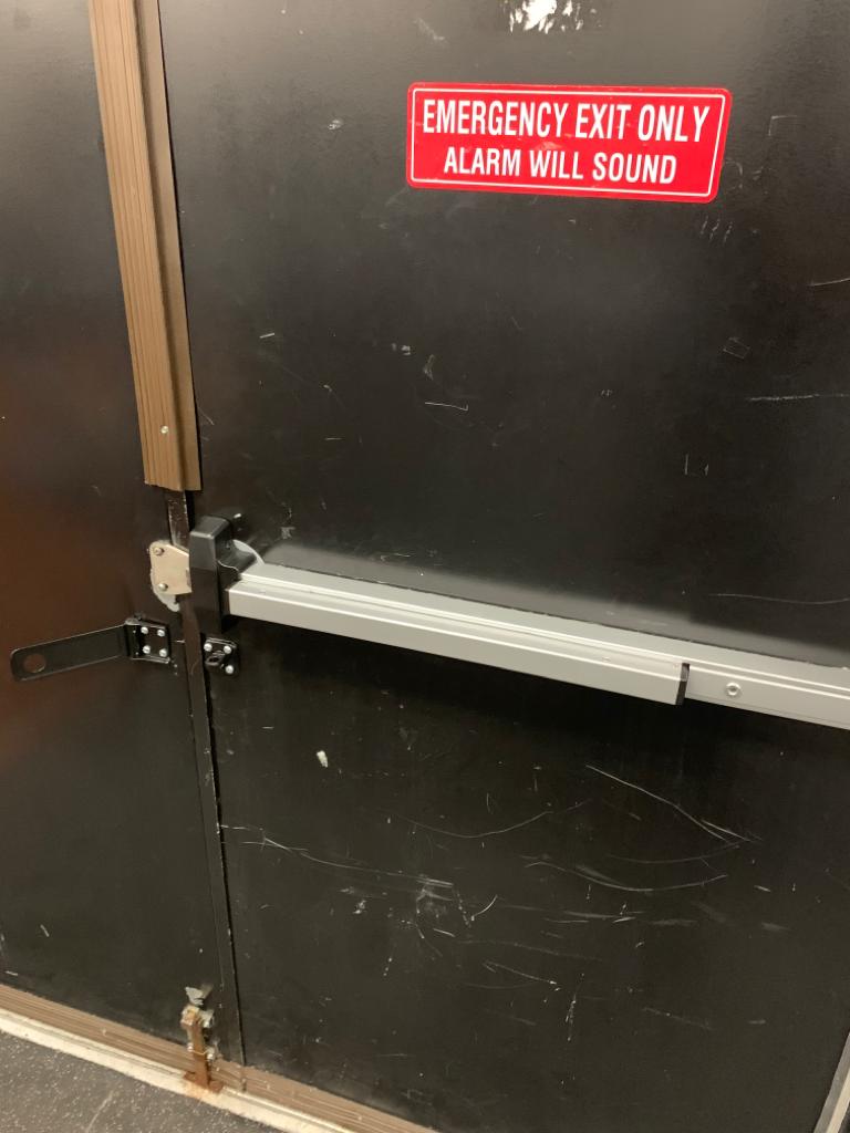 Exit device installed on commercial door
