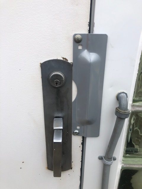 cover plate installed on commercial door